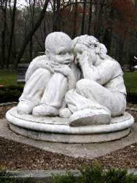 A cast stone sculpture called Whispers by Steve Weitzman