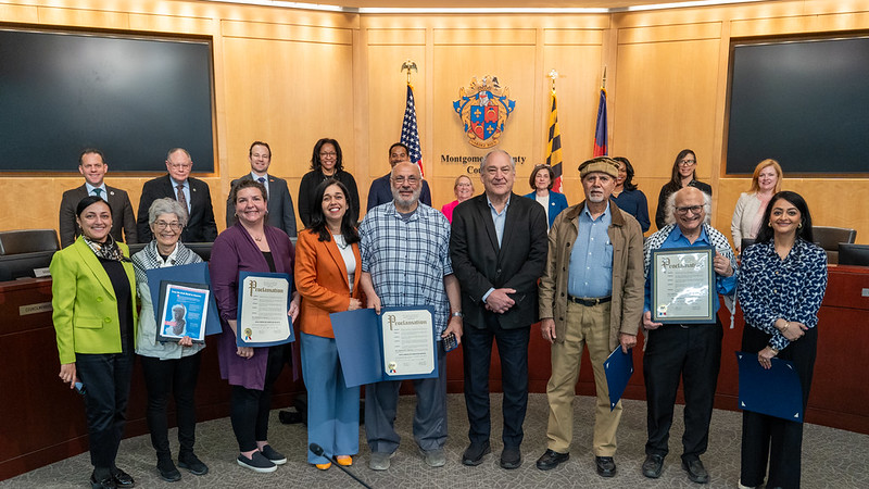 Councilmembers, County Executive Elrich and Arab American leaders gather in the Council chamber for the Arab American Heritage Month proclamation.