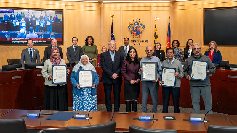 CP Fani-González, County Executive Elrich, Councilmembers and community members hold proclamations in the Council Chamber during Middle Eastern American Heritage Month.