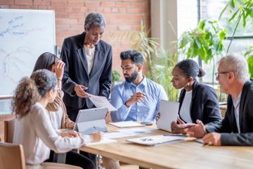 group of people meeting in boardroom
