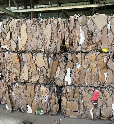 Photo of bales of sorted cardboard ready to ship from the Montgomery County Recycling Center to recycling marktets.