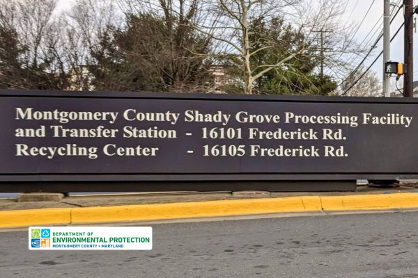 Sign reads Montgomery County Shady Grove Processing Facility and Transfer Station - 16101 Frederick Rd. Recycling Center - 16105 Frederick Rd.