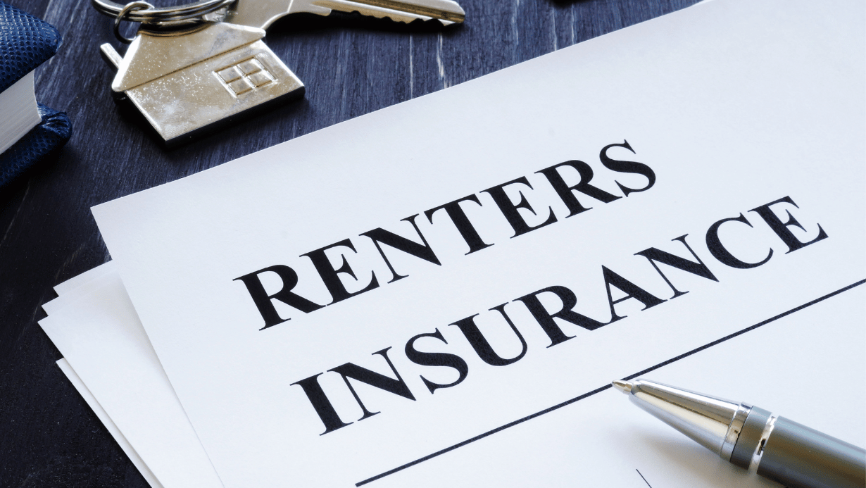 Document labeled Renters Insurance, with ballpoint pen and house-shaped keychain decoration
