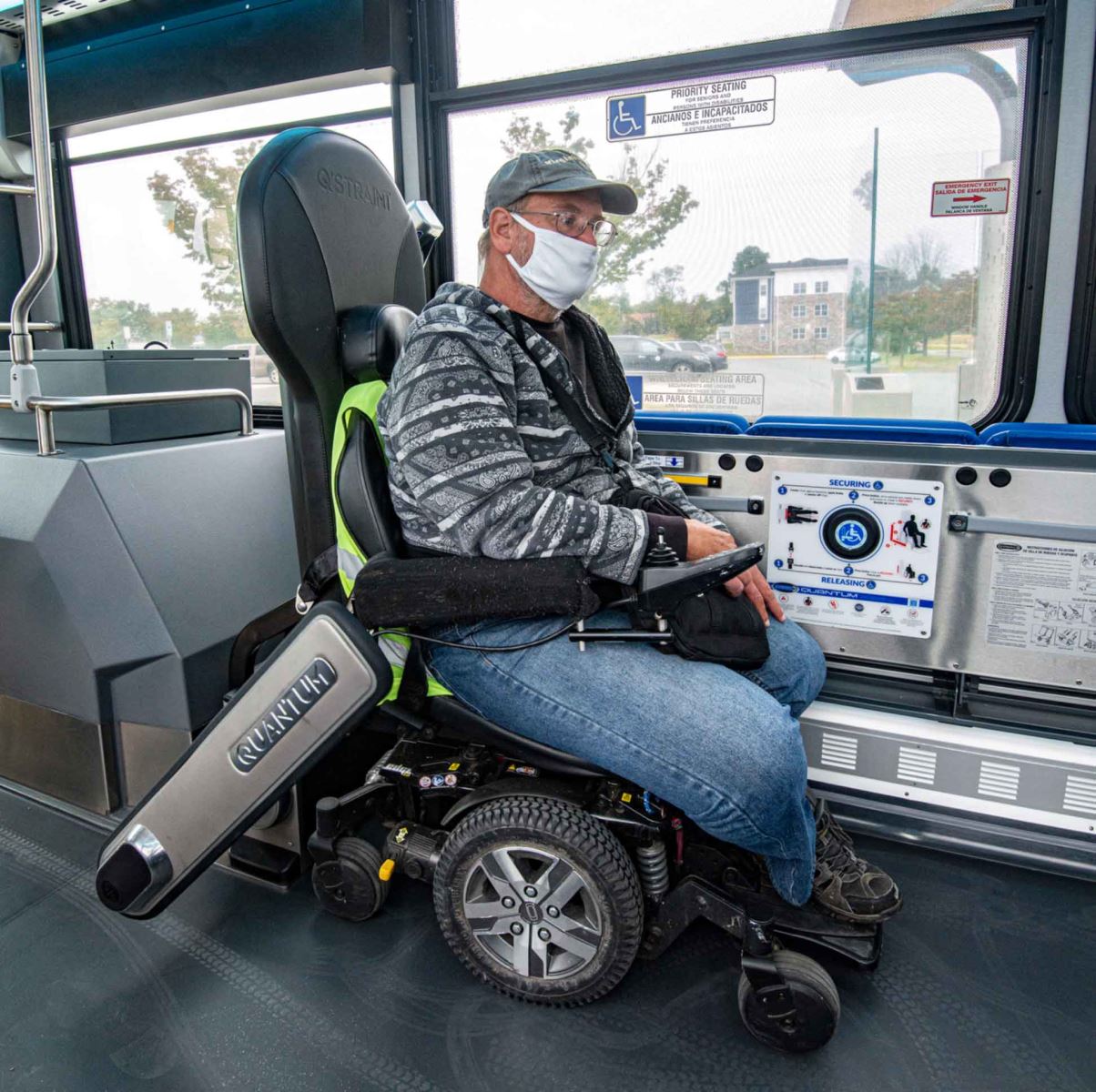 Passenger on bus using Quantum securement system