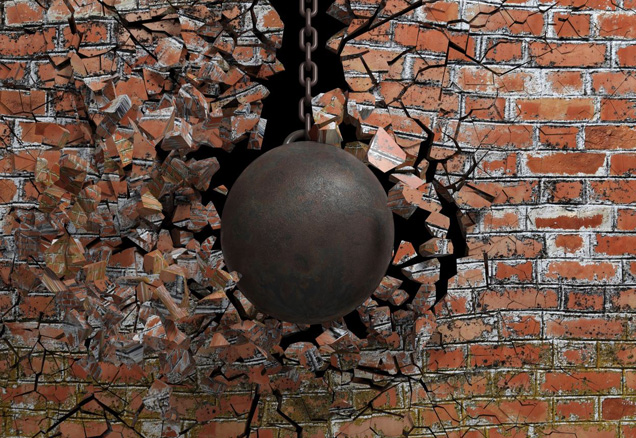 Wrecking ball smashing brick wall
