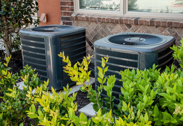 Two outside residential air conditioning units