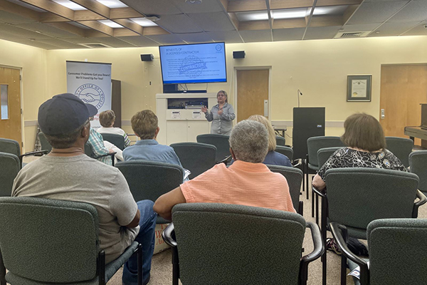 Staff member presenting to an audience