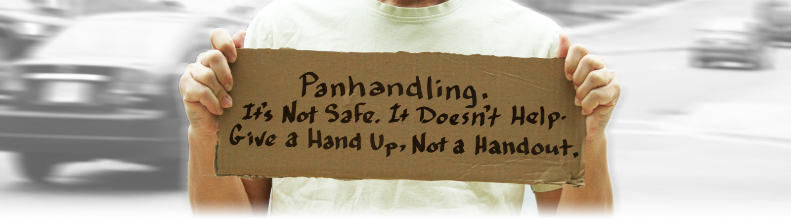 panhandler holding a sign
