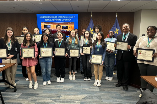 Students being presented certificates from the Closing Ceremony of the S.M.A.R.T. Youth Advisory Council