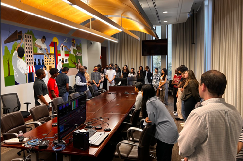 Speaking to students behind the Council hearing room