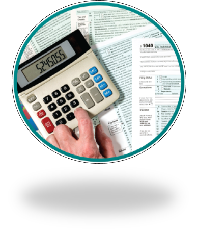 A person is completing their tax forms using a calculator