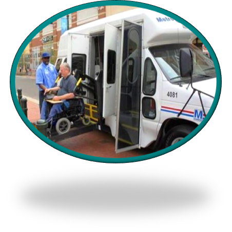 A man who uses a wheelchair exits a MetroAccess vehicle