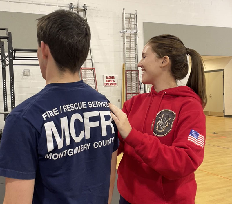 Kelsey Tanler working with a firefighter during a session