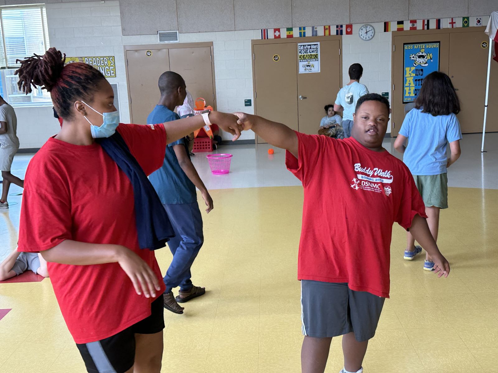 Rec TR specialist high-fives a young participant