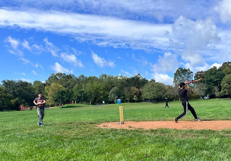 Young boys playing cricket