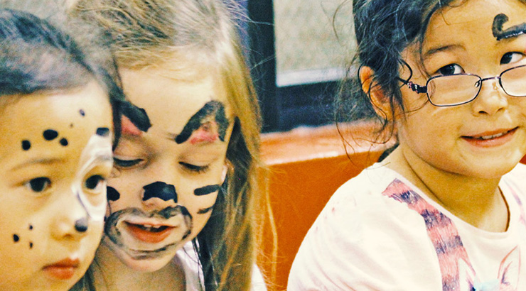 Three girls with painted faces
