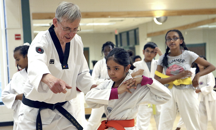 instructor teaching children karate