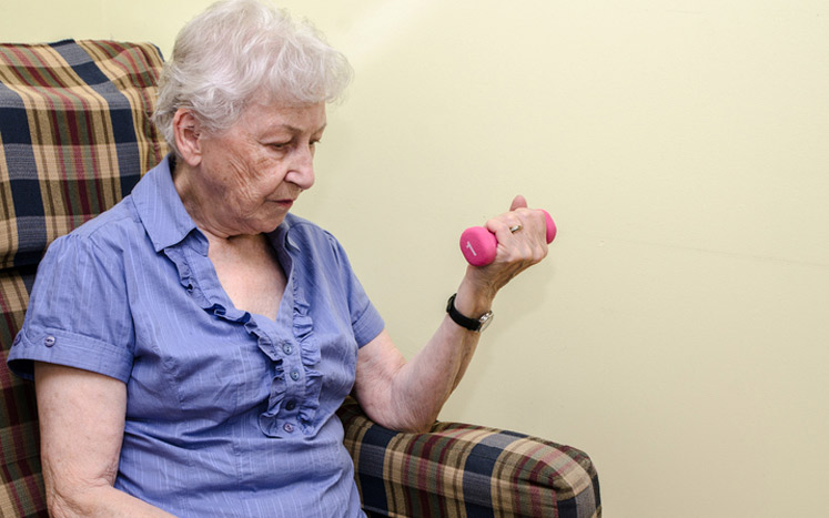 seniors exercising in chair