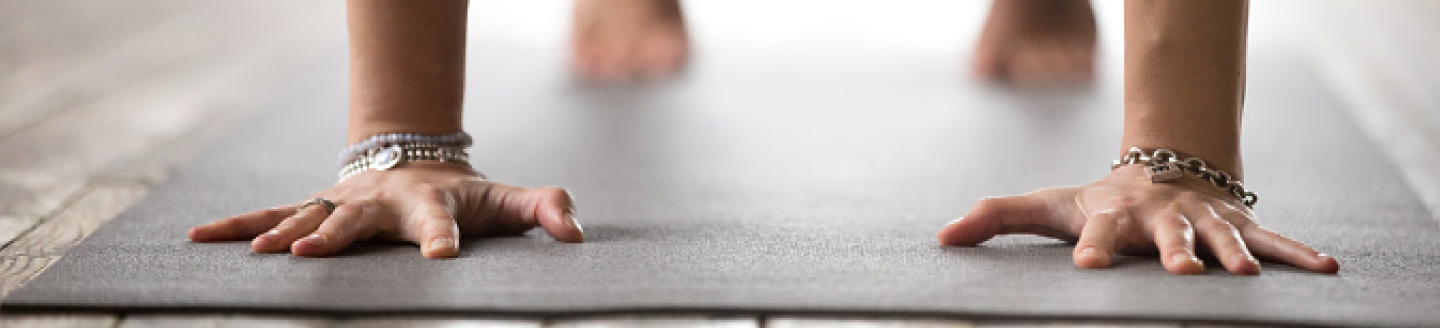 hands on exercise mat in push-up form