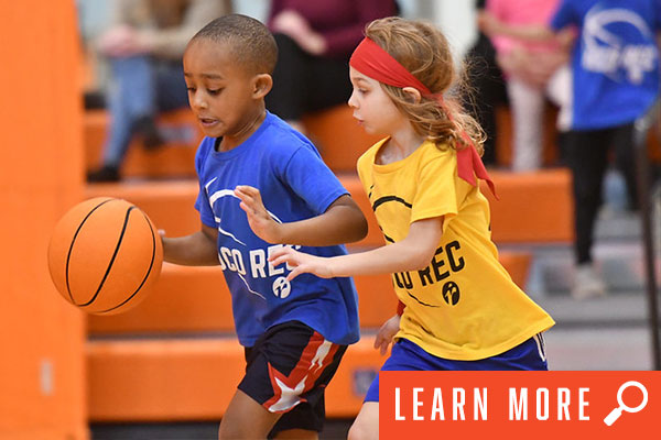 Photo of youth playing basketball. View adult basketball information.