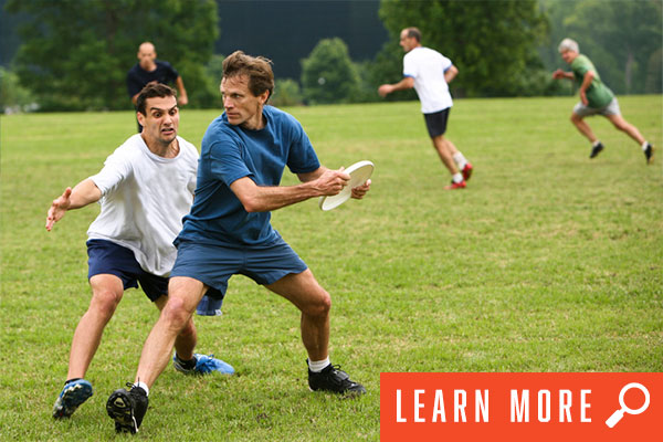 Ultimate frisbee game in motion. View ultimate frisbee information.