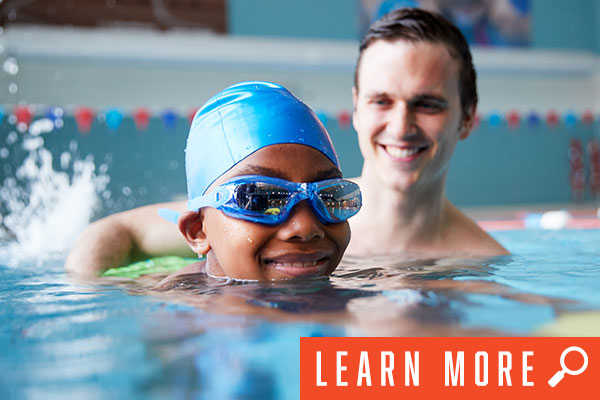 kid in swim lesson, click to learn more