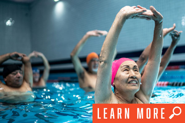 senior woman in group water fitness class, click to learn more