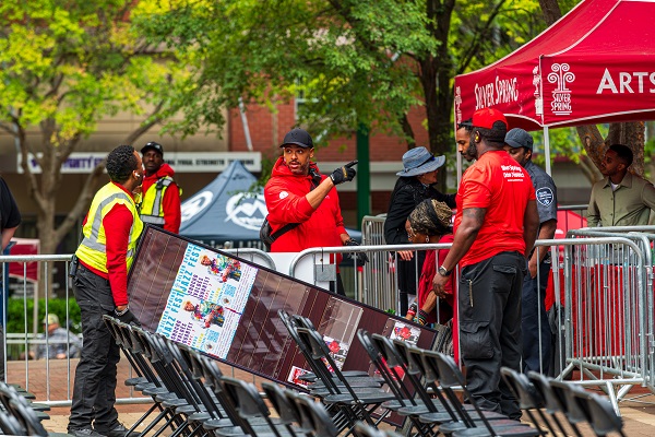 people with red shirts working